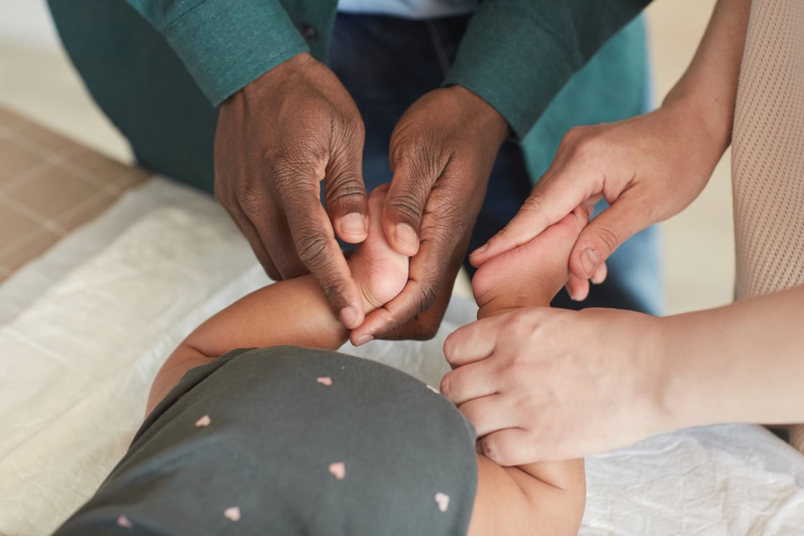 Parents Massaging Baby Feet